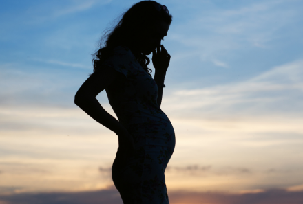 Pregnant woman sunset