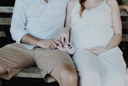 Adopting couple on a bench