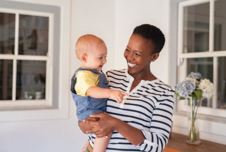 mom holding baby