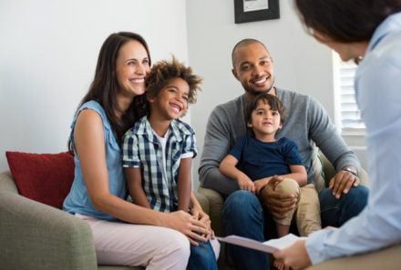 adoptive family smiling together