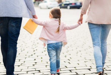 family holding hands walking