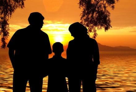 family watching the sunset