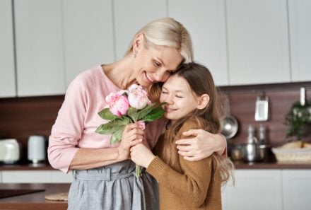 Mother and daughter hugging